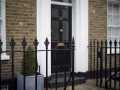 Heavy gauge MN136 railings at a London front entrance