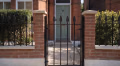 MN188 garden gate and railings on a red-brick front wall