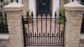 Heavy gauge MN162 garden gate, hung between brick piers